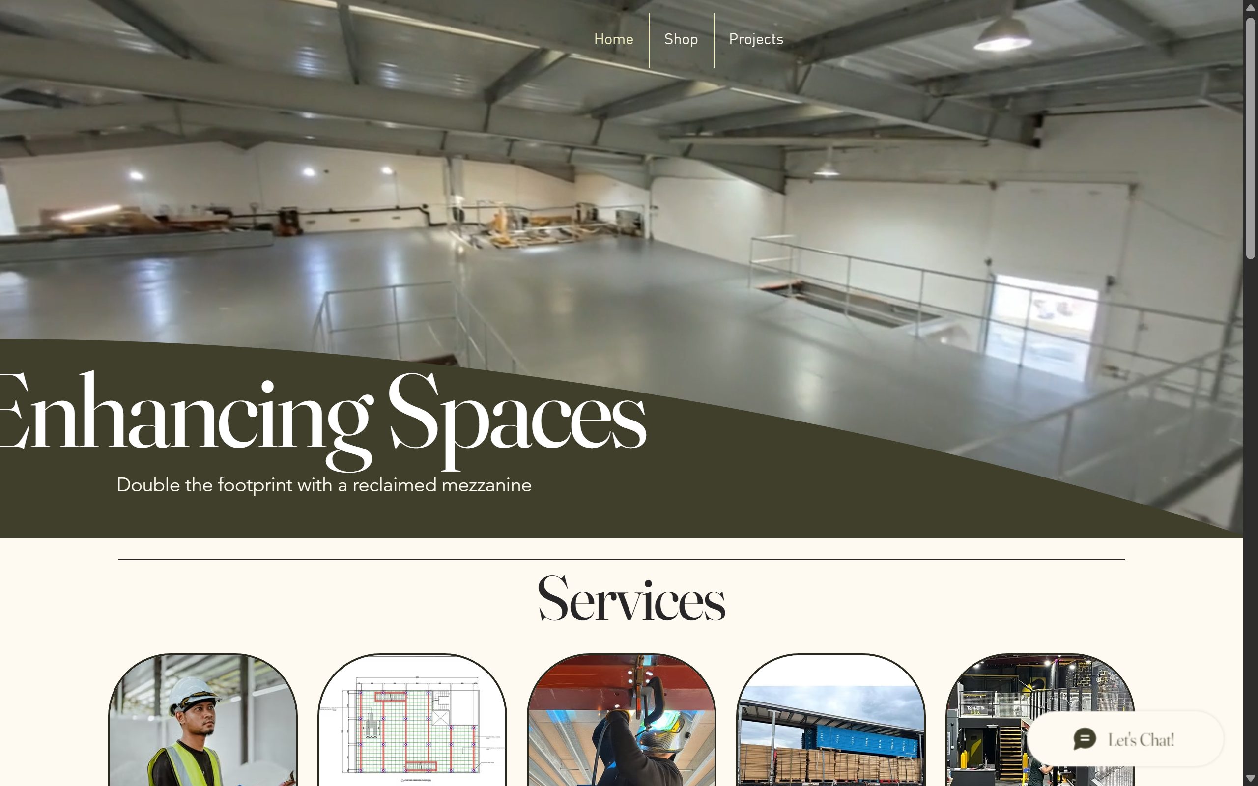 The previous Wix site: a stock warehouse photo with the headline “Enhancing Spaces” running off the left edge of the screen, and a chat widget in the corner.